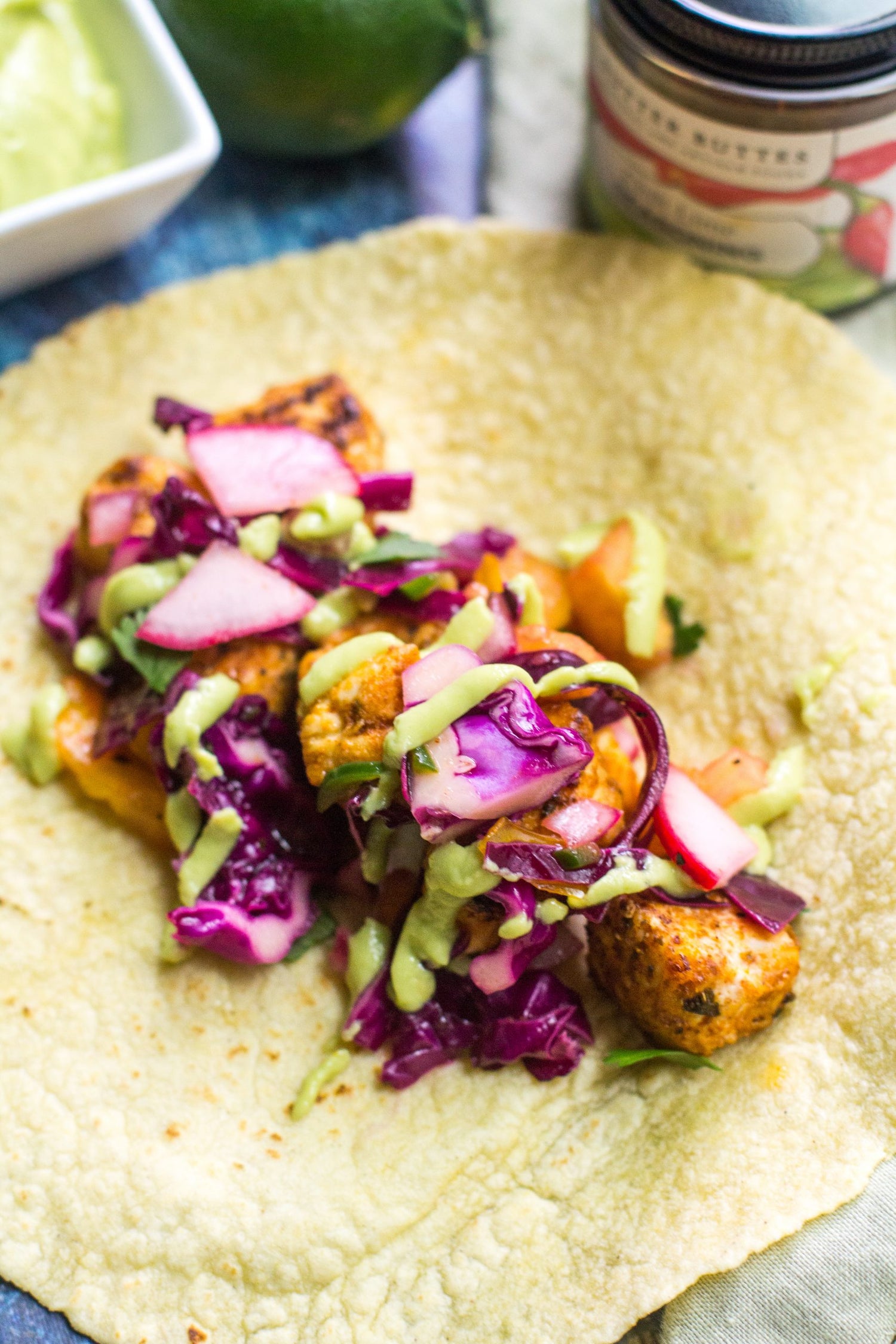 Fish Tacos with Avocado Crema and Cabbage Slaw
